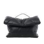 Black Celine Pillow leather handbag with a padded rectangular shape, oversized folded flap, slim top handle and small Celine Paris logo near the base.