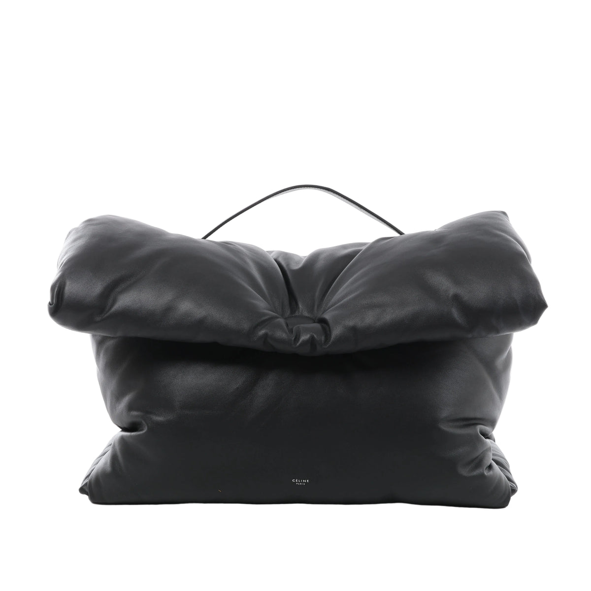 Black Celine Pillow leather handbag with a padded rectangular shape, oversized folded flap, slim top handle and small Celine Paris logo near the base.