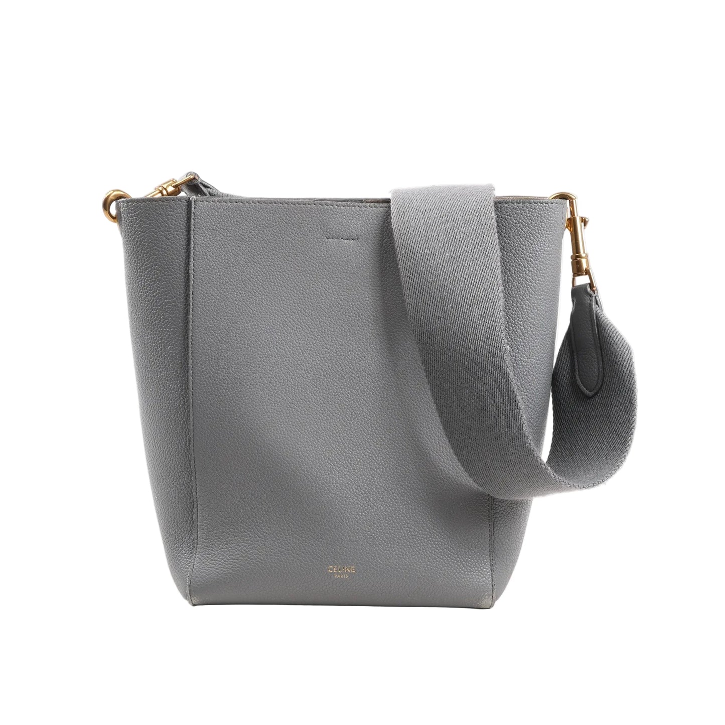 CELINE Seau Sangle Bucket Mini Shoulder Bag in gray grained leather with a wide adjustable strap, gold-tone hardware, and minimalist logo stamp at the bottom front, displayed upright on a white background.