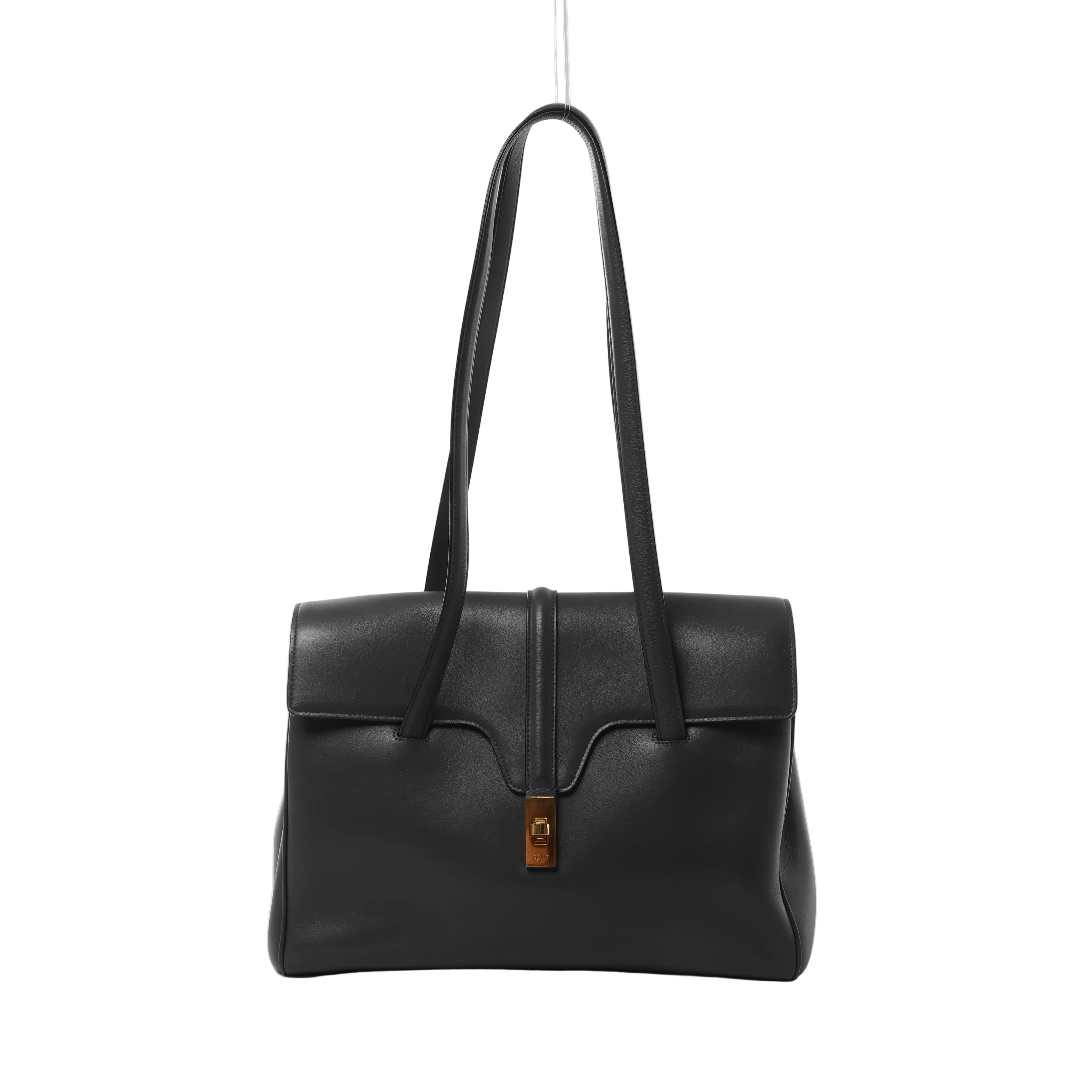 Dark gray Celine leather shoulder bag with long shoulder straps, structured flap, central leather tab and gold-tone clasp hardware.