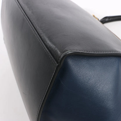 Sac à main double sens en cuir et daim trapèze CELINE en noir, bleu marine et taupe