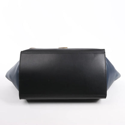Sac à main double sens en cuir et daim trapèze CELINE en noir, bleu marine et taupe