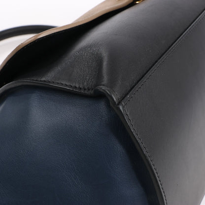 Sac à main double sens en cuir et daim trapèze CELINE en noir, bleu marine et taupe