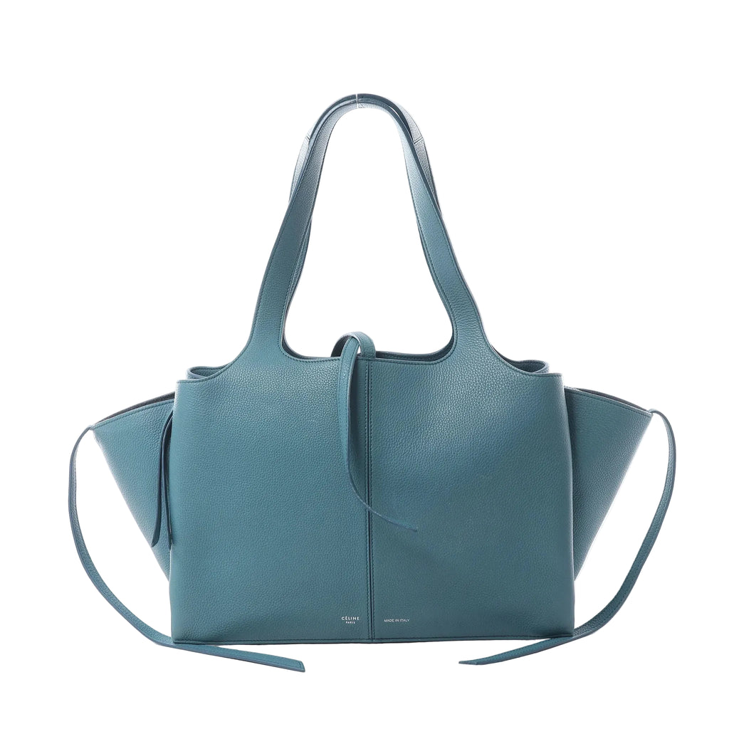 Celine Tri-Fold shoulder bag in blue grained leather with integrated handles, flared side panels and long leather side ties.