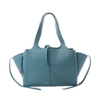 Celine Tri-Fold shoulder bag in blue grained leather with integrated handles, flared side panels and long leather side ties.