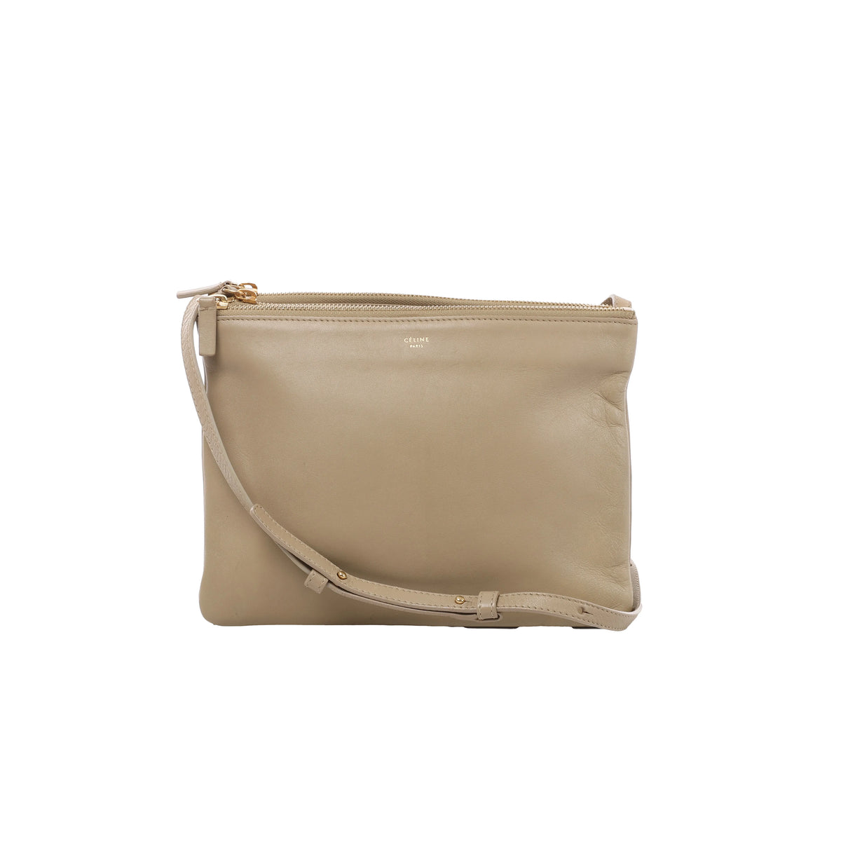Front view of Celine Trio Large beige leather crossbody bag with layered zip pouches, gold-tone hardware and a slim adjustable leather strap.