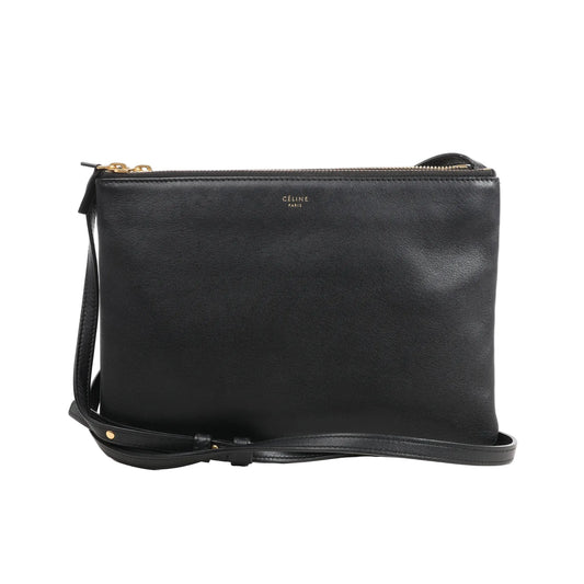 Celine Trio Large crossbody bag in black smooth leather featuring three zippered compartments, adjustable leather strap, and gold Celine Paris logo.