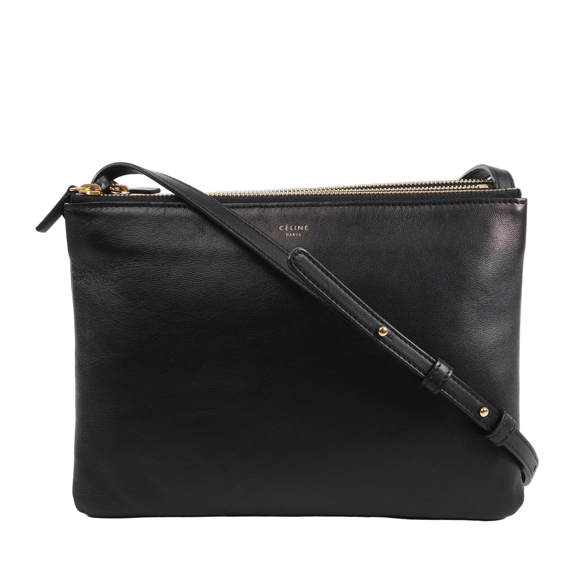 Celine Trio Large Leather Crossbody Bag in black smooth leather with gold-tone zippers, three connected zip compartments, and adjustable shoulder strap, displayed upright against a white background.