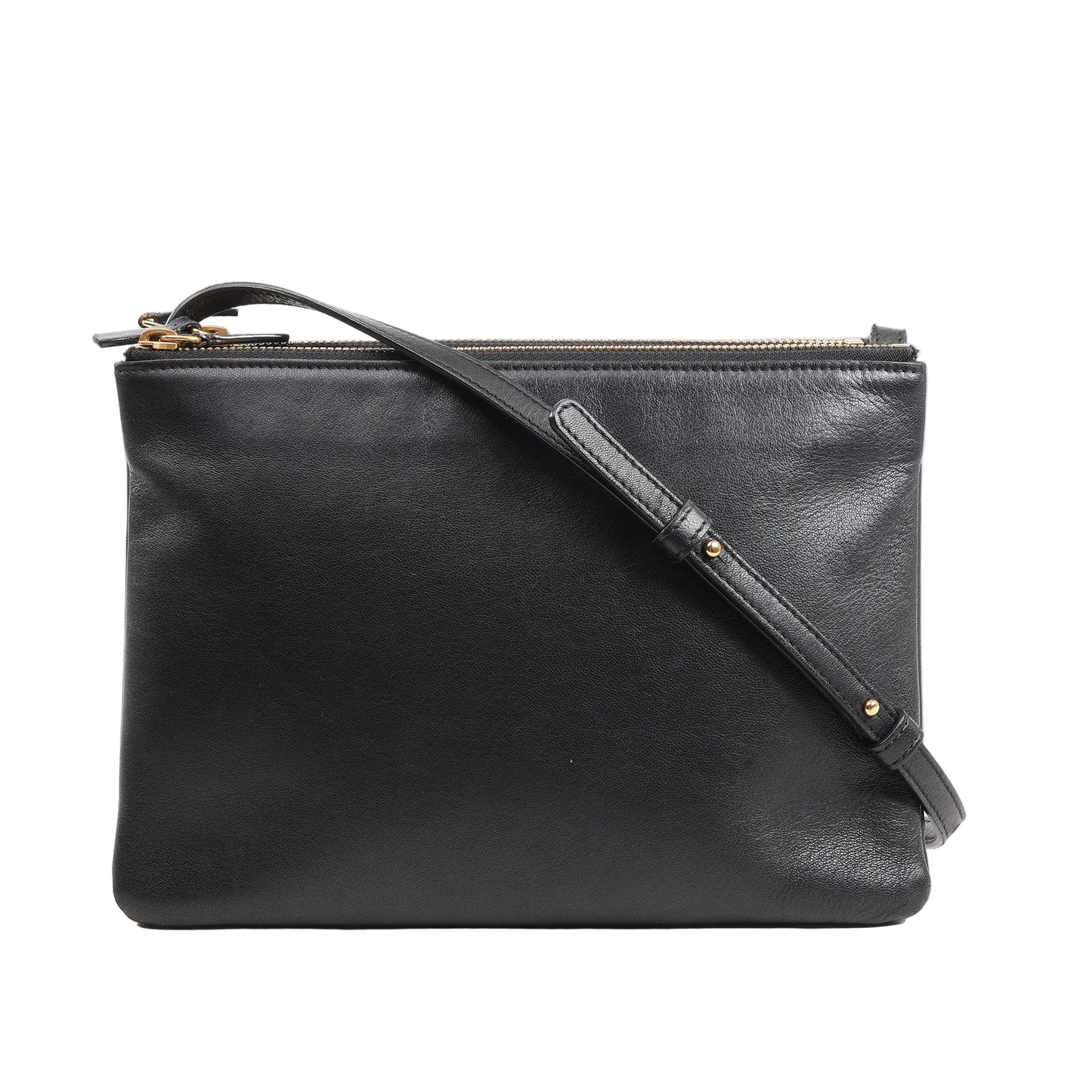 Front view of a Celine Trio Large Crossbody Bag in smooth black leather featuring a clean rectangular silhouette, adjustable leather shoulder strap with gold-tone hardware, and multiple zippered compartments.