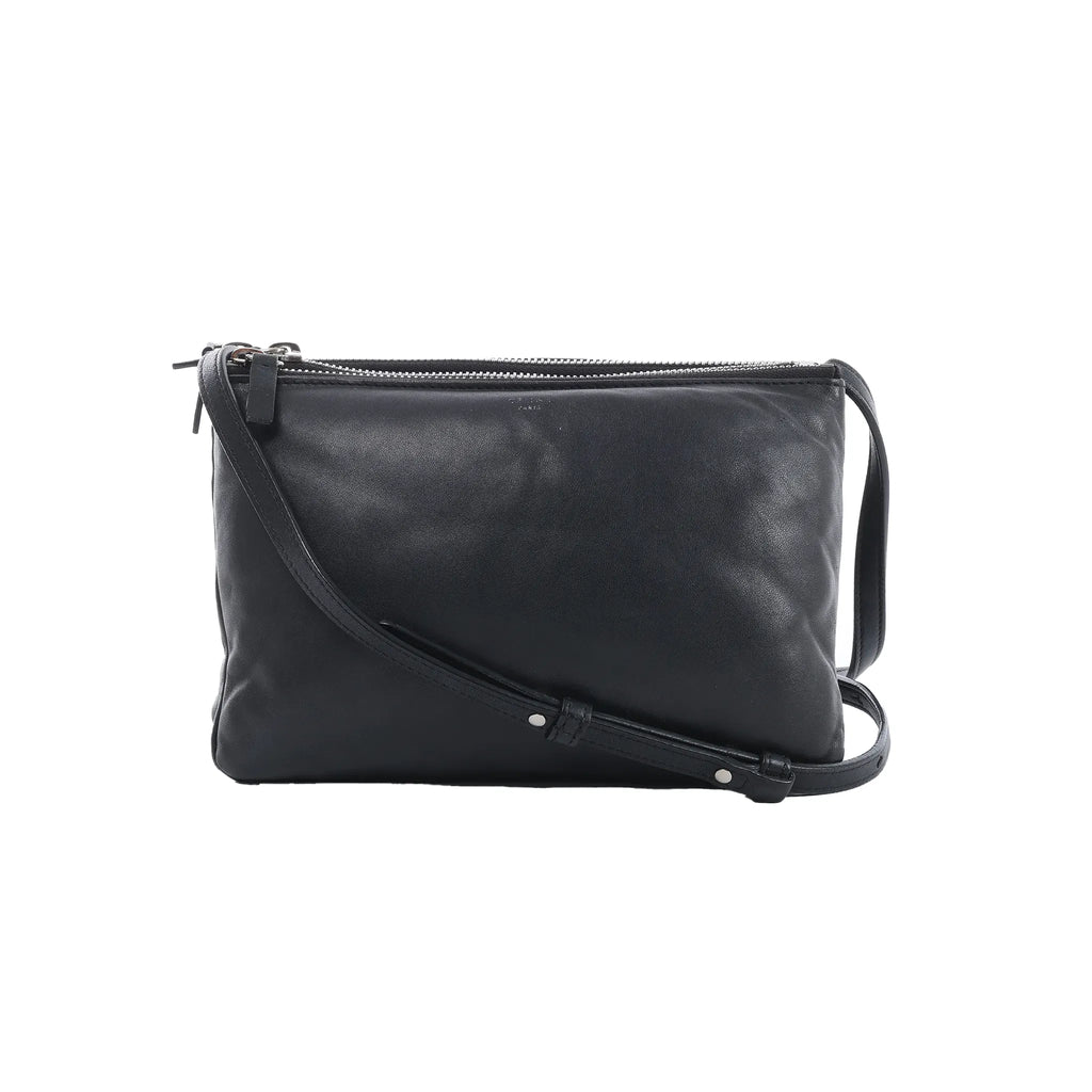 Celine Soft Trio Small crossbody bag in black leather with a slim adjustable strap, soft rectangular shape and silver-tone top zippers.