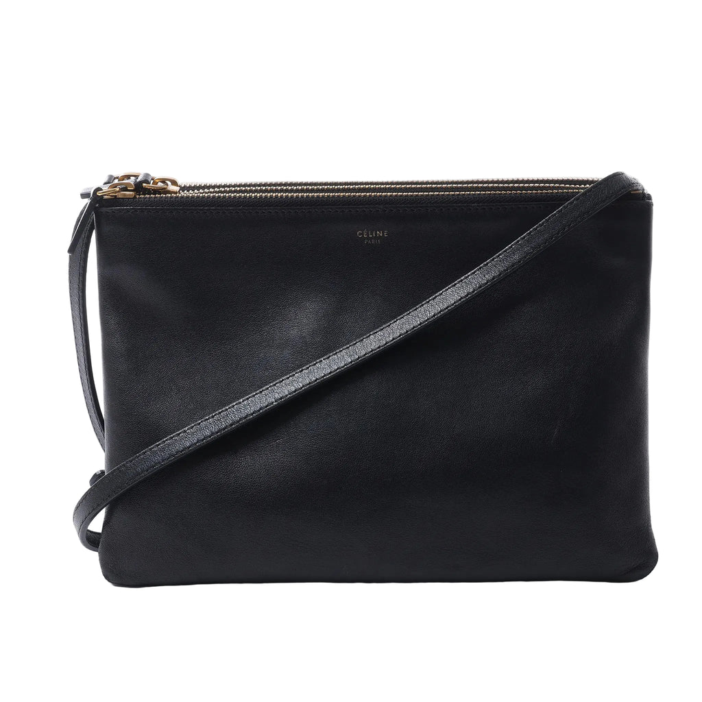 Celine Trio Large black leather crossbody bag with three top zip compartments, gold-tone logo and slim adjustable shoulder strap.