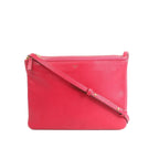 Pink Celine Trio Large leather crossbody bag with slim shoulder strap, top zipper closure, and small Celine Paris logo, front view on white background.
