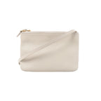 Celine Trio small crossbody bag in ecru leather with a minimalist rectangular shape, zip-top closure, gold-tone hardware, and slim shoulder strap on a white background.