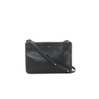 Black Celine Trio Small leather crossbody bag with zip-top closure, small gold logo, and slim strap with gold rivet details on a white background