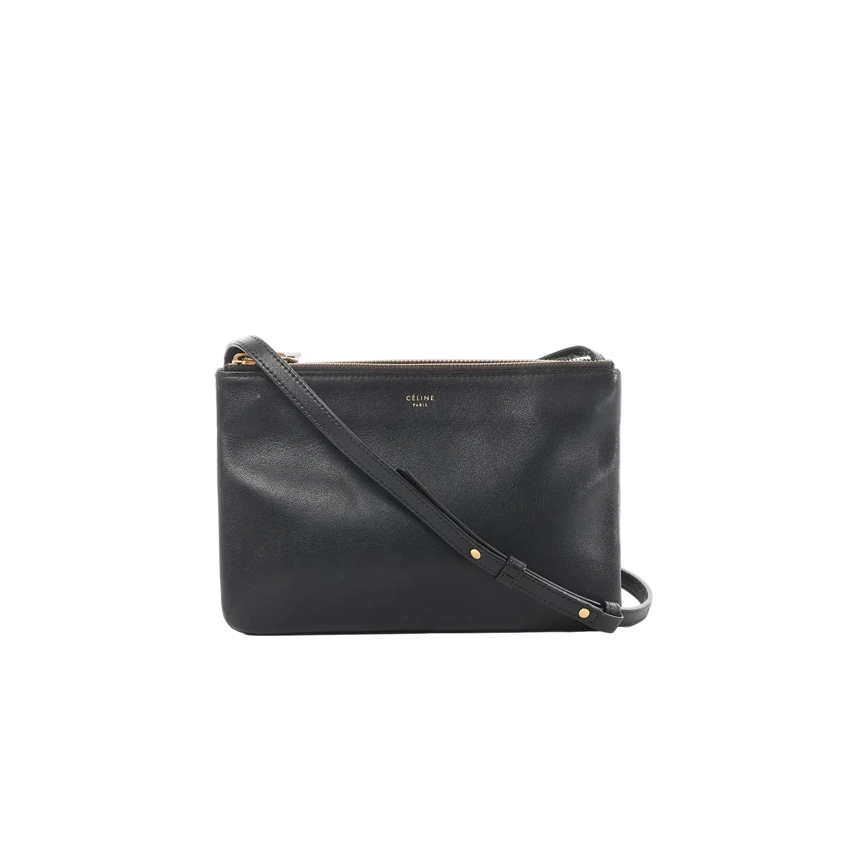 Black Celine Trio Small leather crossbody bag with zip-top closure, small gold logo, and slim strap with gold rivet details on a white background