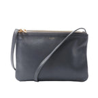 Celine Trio Small dark grey leather crossbody bag with three top zip compartments, gold-tone logo and slim adjustable shoulder strap.
