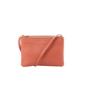 Celine Trio Small orange leather crossbody bag with slim shoulder strap, gold-tone zip-top closure, and small Celine logo stamp on the front.