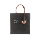 Front view of Celine Triomphe Vertical Cabas Large tote in black Triomphe-coated canvas with brown leather top handles and trim, large white CELINE logo, and hanging leather clochette.
