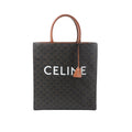Front view of Celine Triomphe Vertical Cabas Large tote in black Triomphe-coated canvas with brown leather top handles and trim, large white CELINE logo, and hanging leather clochette.
