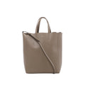 Front view of Celine Vertical Cabas Small beige grained leather handbag with twin top handles, matching shoulder strap and gold-tone logo.