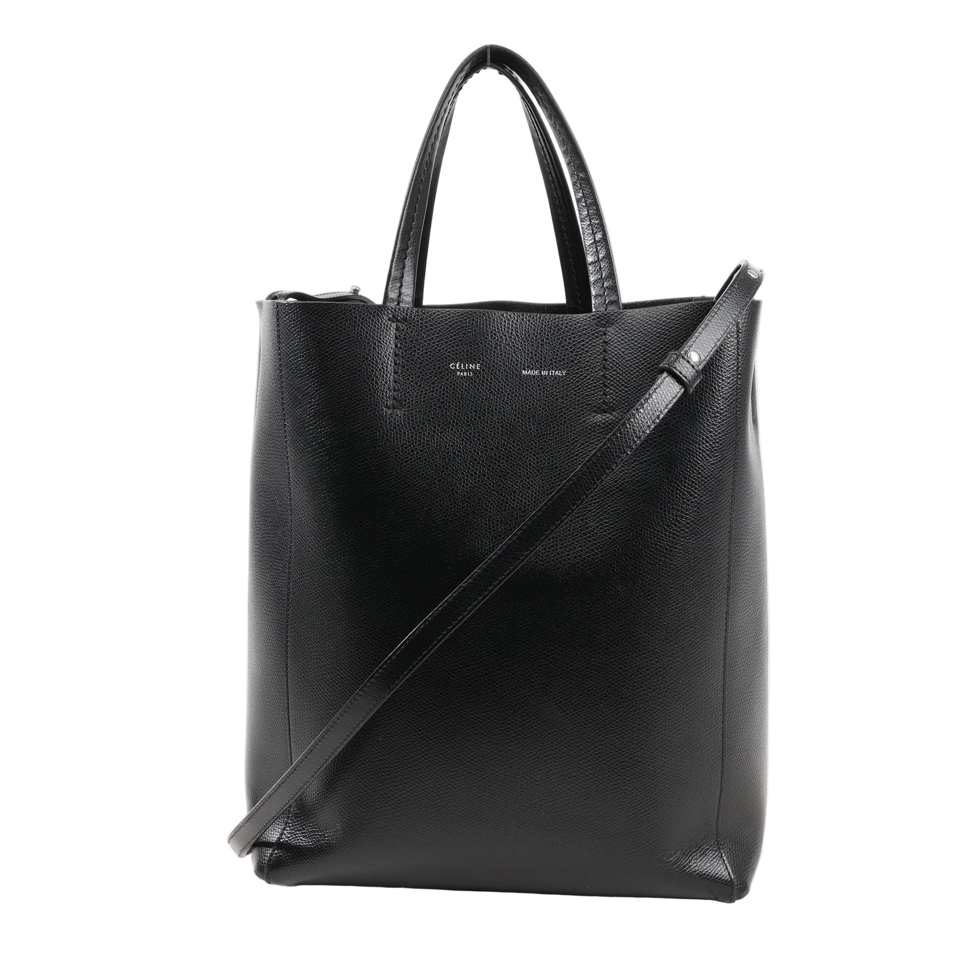 CELINE Cabas Vertical Small handbag in black grained leather with top handles, slim crossbody strap, and minimalist silver branding on front.