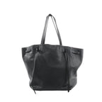 Black Celine Cabas Phantom Medium leather shoulder tote with two long top handles, open-top silhouette, and front panel with knotted leather tie details, shown on a white background.