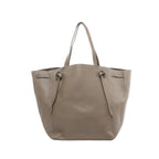 Taupe Celine Cabas Phantom Medium leather shoulder tote with two long top handles, open-top design, and front panel with knotted leather tie details, shown on a white background.
