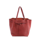 Celine Cabas Phantom Small shoulder bag in red grained leather with long handles, an open top and knotted front tie closure.