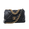 Chanel 19 Large black quilted leather shoulder bag with gold and silver-tone chain straps, leather-threaded strap, and CC turn-lock closure on white background.
