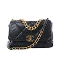 Chanel 19 Large black quilted leather shoulder bag with gold and silver-tone chain straps, leather-threaded strap, and CC turn-lock closure on white background.