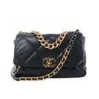 Chanel 19 Large black quilted leather shoulder bag with gold and silver-tone chain straps, leather-threaded strap, and CC turn-lock closure on white background.