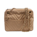 Beige Chanel leather shoulder bag with chevron quilting, gold-tone chain straps, top zip closure and round CC charm.