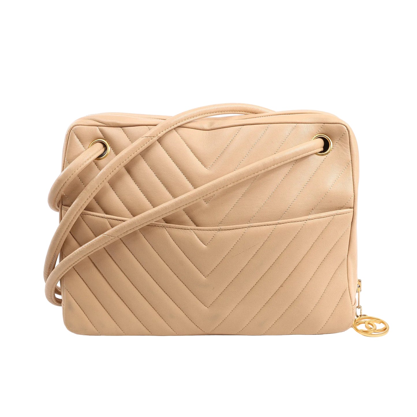 Front view of a Chanel Chevron shoulder bag in beige leather featuring V-quilted stitching, a long leather shoulder strap, external slip pocket, and gold-tone hardware with signature CC charm zipper pull.