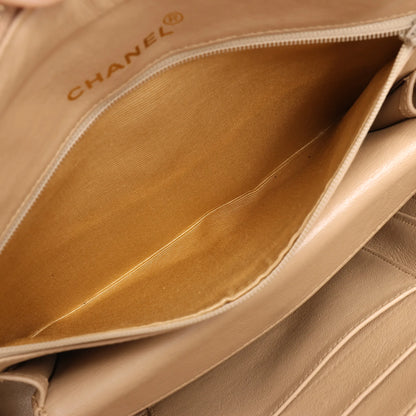 Sac à bandoulière en cuir à chevrons Chanel beige 1881694