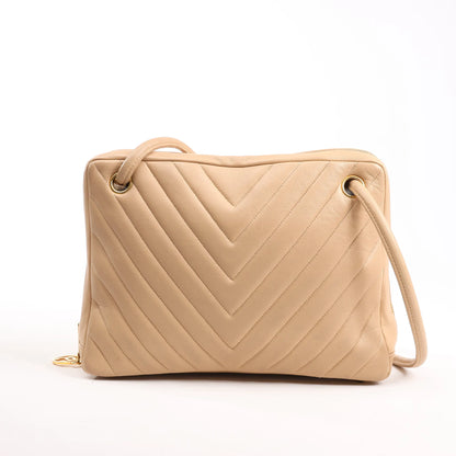 Sac à bandoulière en cuir à chevrons Chanel beige 1881694