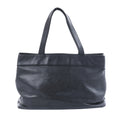 Chanel black Caviar leather tote bag with long shoulder handles, tonal interlocking CC logo and silver-tone snap closure.