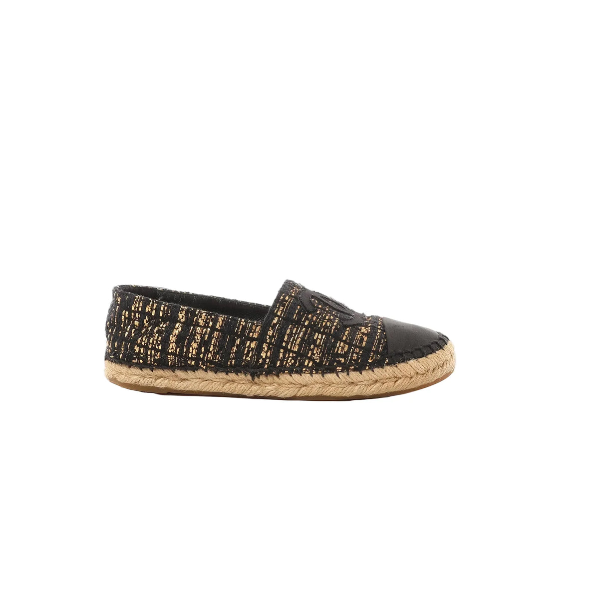 Chanel black and gold metallic tweed espadrille with black toe cap, stitched CC logo, and braided jute sole, shown in side profile on a white background.