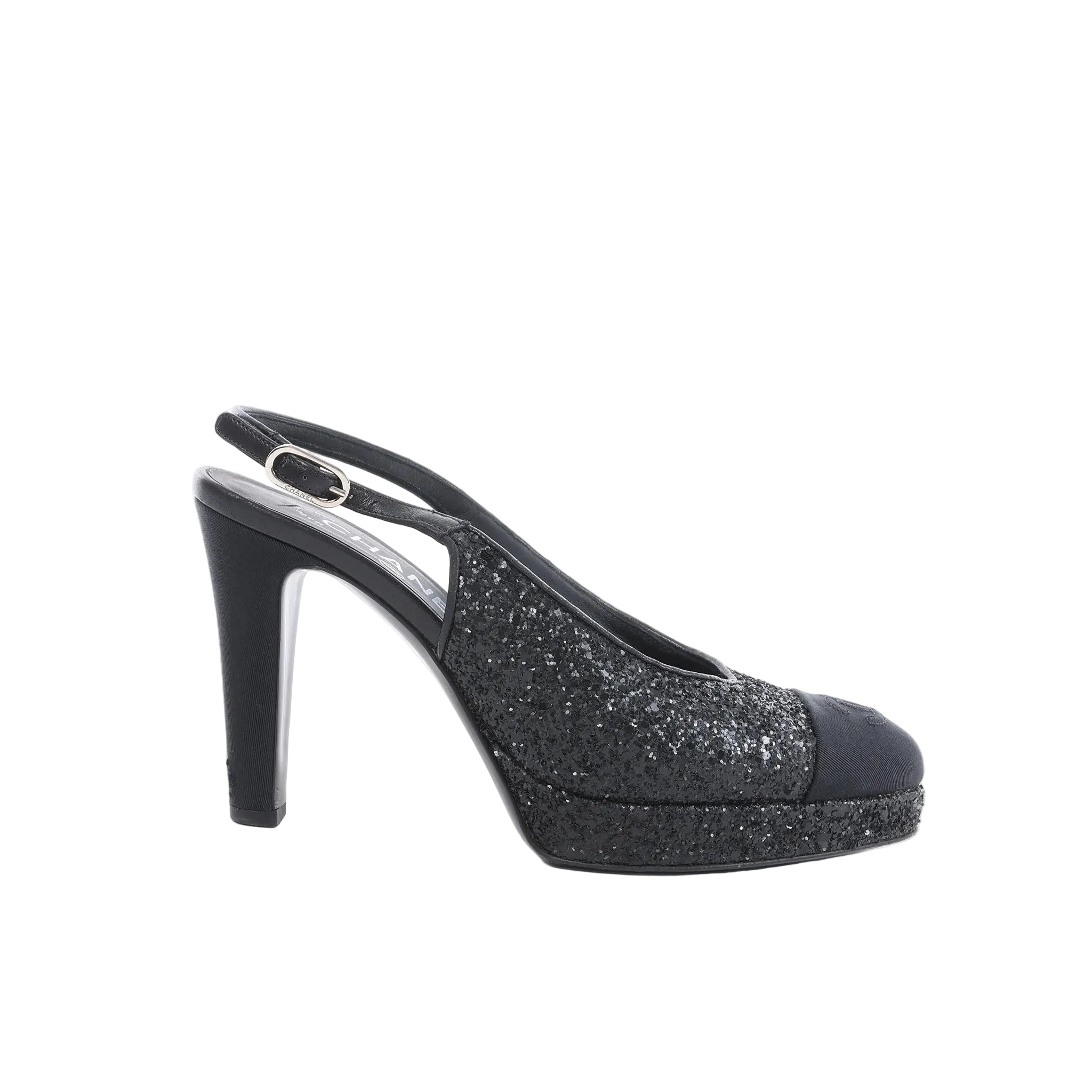 Side view of black Chanel slingback heel with glitter upper, rounded toe cap, platform sole, and high heel on white background.