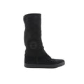 Chanel black suede boots with quilted matelassé shaft, round toe, rubber sole, and Coco logo patch on the side on white background