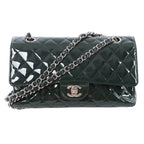 Chanel Classic Medium Double Flap shoulder bag in green quilted patent leather with silver-tone CC turn-lock closure and leather-woven double chain strap, displayed against a white background.