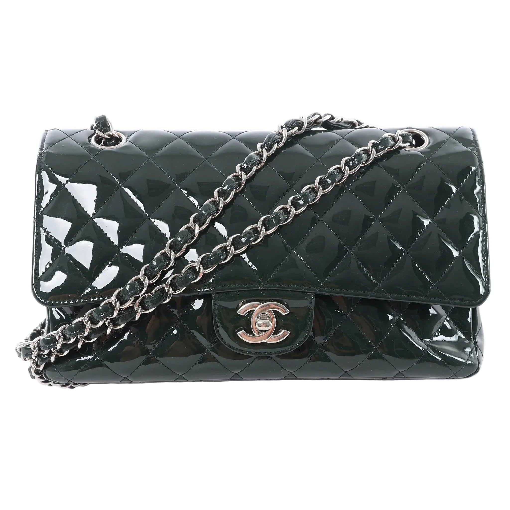 Chanel Classic Medium Double Flap shoulder bag in green quilted patent leather with silver-tone CC turn-lock closure and leather-woven double chain strap, displayed against a white background.