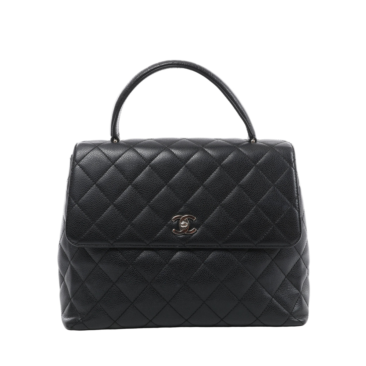 Front view of a black Chanel Kelly handbag with grained leather, diamond quilting, a curved top handle and a silver-tone CC turn-lock on the flap.