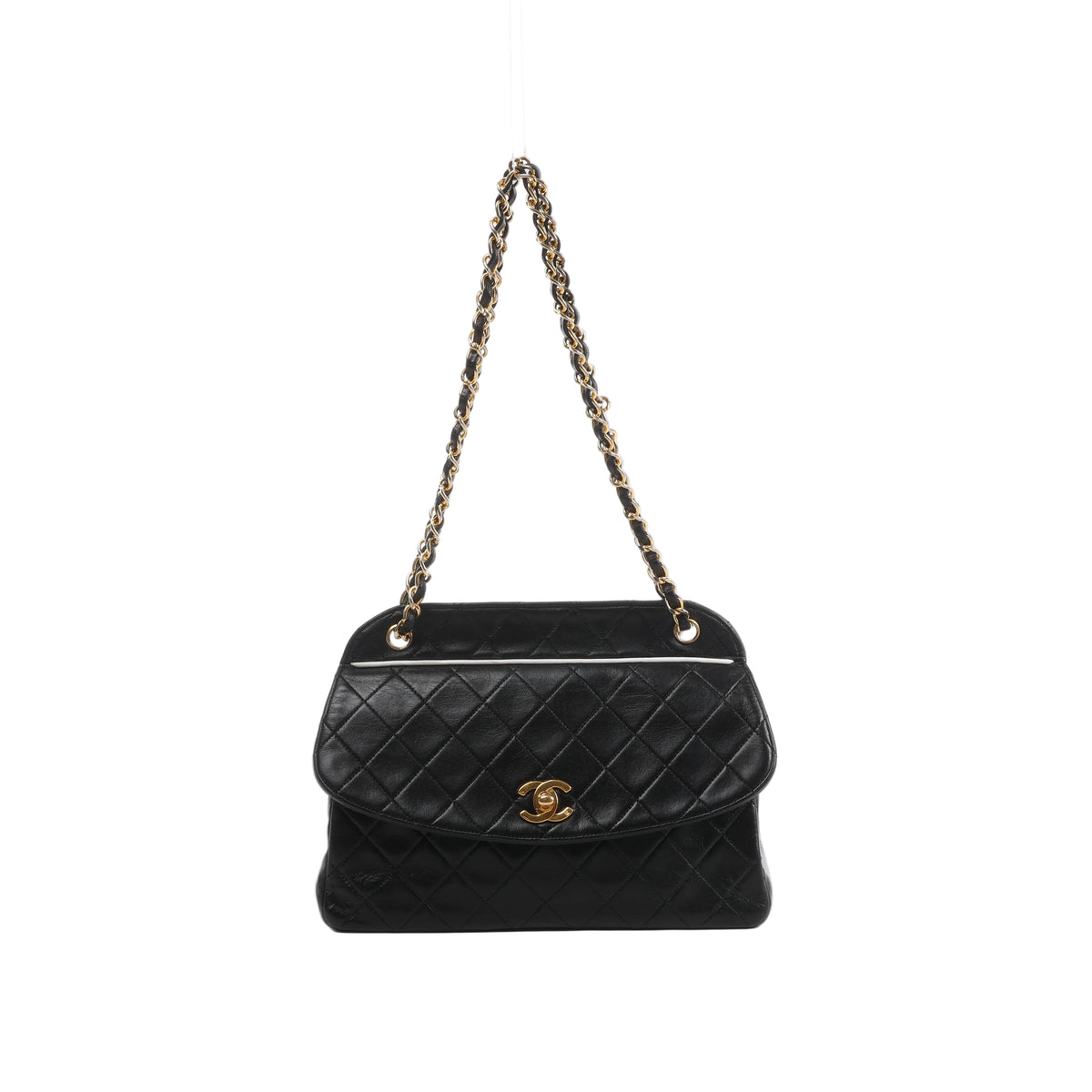 Front view of Chanel black quilted leather shoulder bag with a curved flap, gold-tone CC turn-lock and leather-threaded gold-tone chain strap.