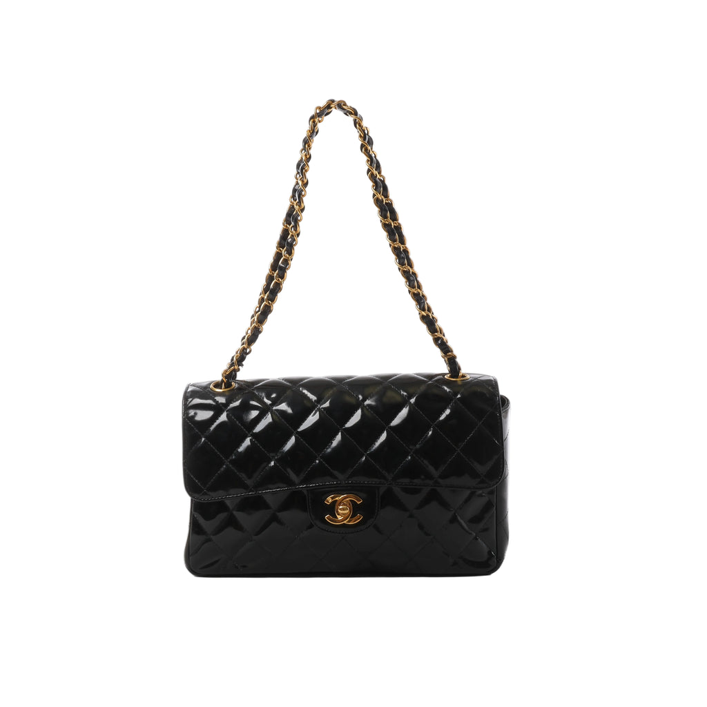 Black Chanel patent leather shoulder bag with diamond quilting, gold-tone CC turn-lock and black leather-woven chain strap.