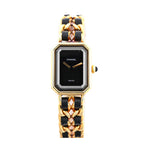 Chanel Première M H6951 quartz watch with black rectangular dial, gold-plated bezel, and interwoven black leather and gold chain bracelet, displayed on a white background.