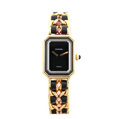 Chanel Première M H6951 quartz watch with black rectangular dial, gold-plated bezel, and interwoven black leather and gold chain bracelet, displayed on a white background.