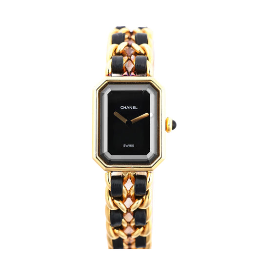 Chanel Première M H6951 quartz watch with black rectangular dial, gold-plated bezel, and interwoven black leather and gold chain bracelet, displayed on a white background.