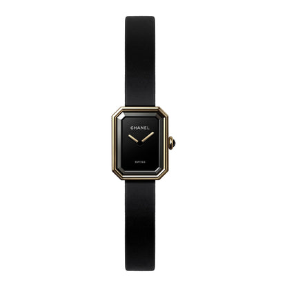 Front view of a Chanel Première H6125 watch featuring a black octagonal dial, 18K yellow gold titanium case, gold-tone hands, and a slim black rubber strap.