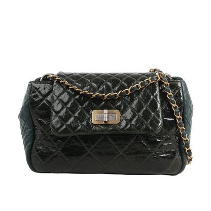 Chanel Reissue Accordion Shoulder Bag in green quilted leather mix with flap closure, aged gold-tone chain and turn-lock clasp, displayed against a white background.