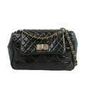 Chanel Reissue Accordion Shoulder Bag in green quilted leather mix with flap closure, aged gold-tone chain and turn-lock clasp, displayed against a white background.